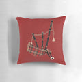 A plush, tartan-patterned pillow featuring a Scottish bagpipe motif, perfect for adding a touch of Scottish pride to your home.
