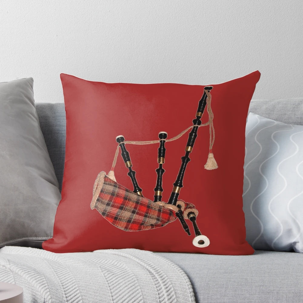 A plush, tartan-patterned pillow featuring a Scottish bagpipe motif, perfect for adding a touch of Scottish pride to your home.