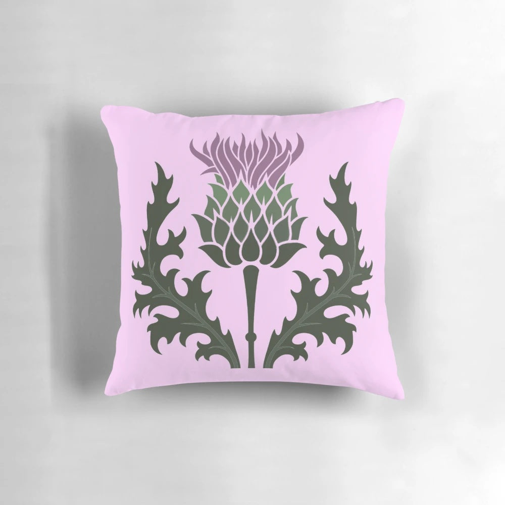 A Scottish thistle flower, the national flower of Scotland, on a pale pink pillow.