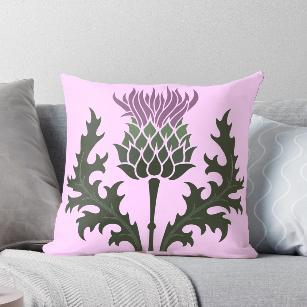 A Scottish thistle flower, the national flower of Scotland, on a pale pink pillow.