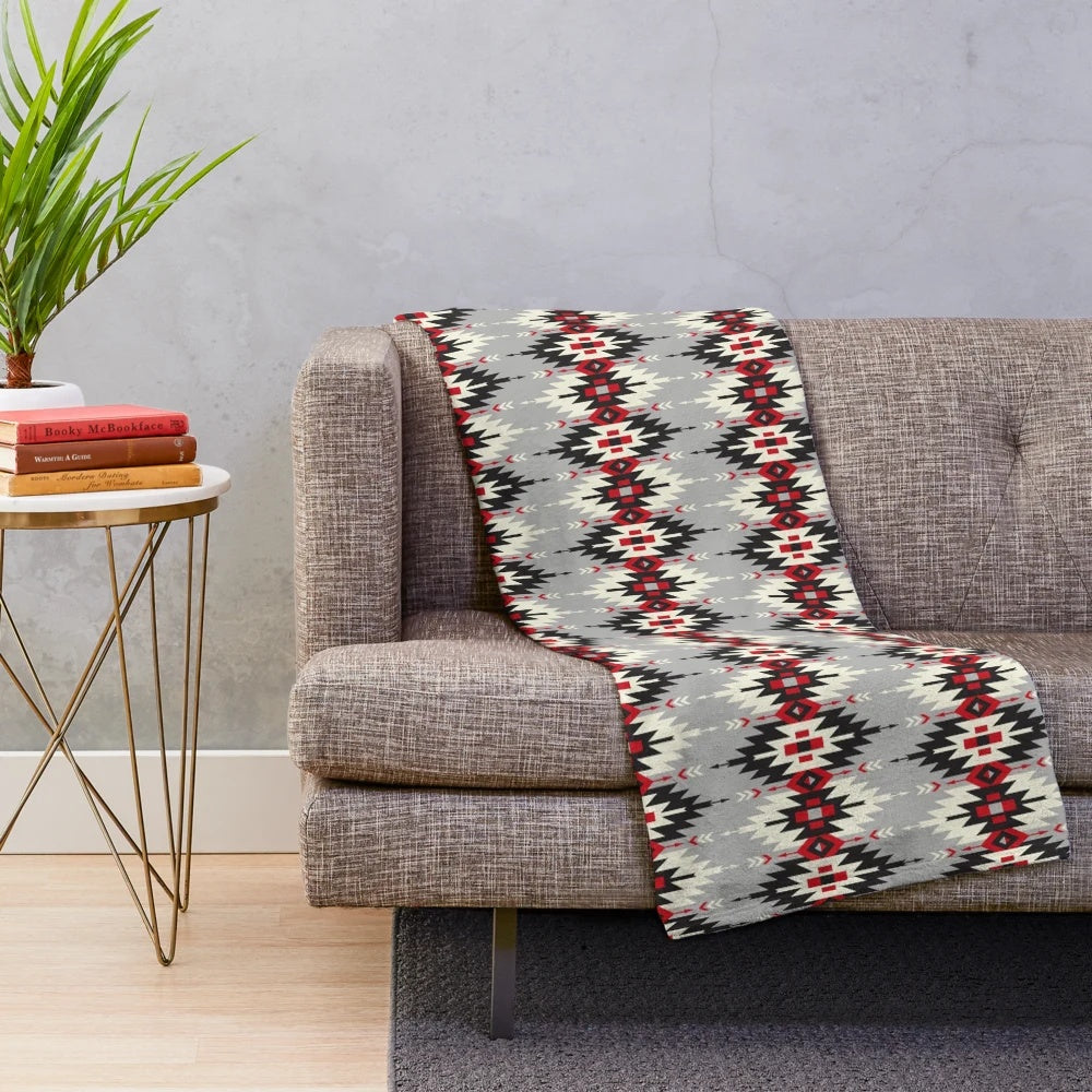 Plush blanket featuring native American-inspired artwork and designs