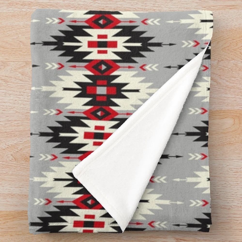 Plush blanket featuring native American-inspired artwork and designs
