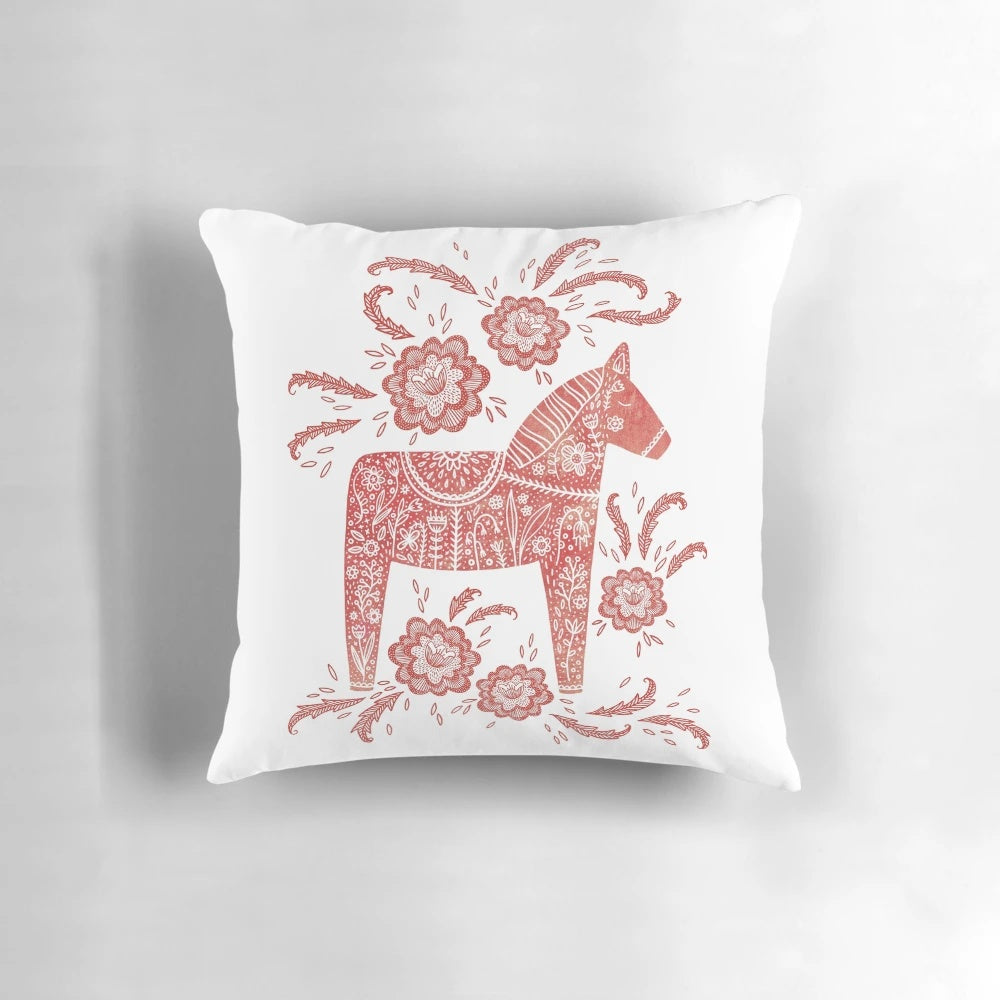 A vibrant red and white Dala horse folk art design decorative throw pillow