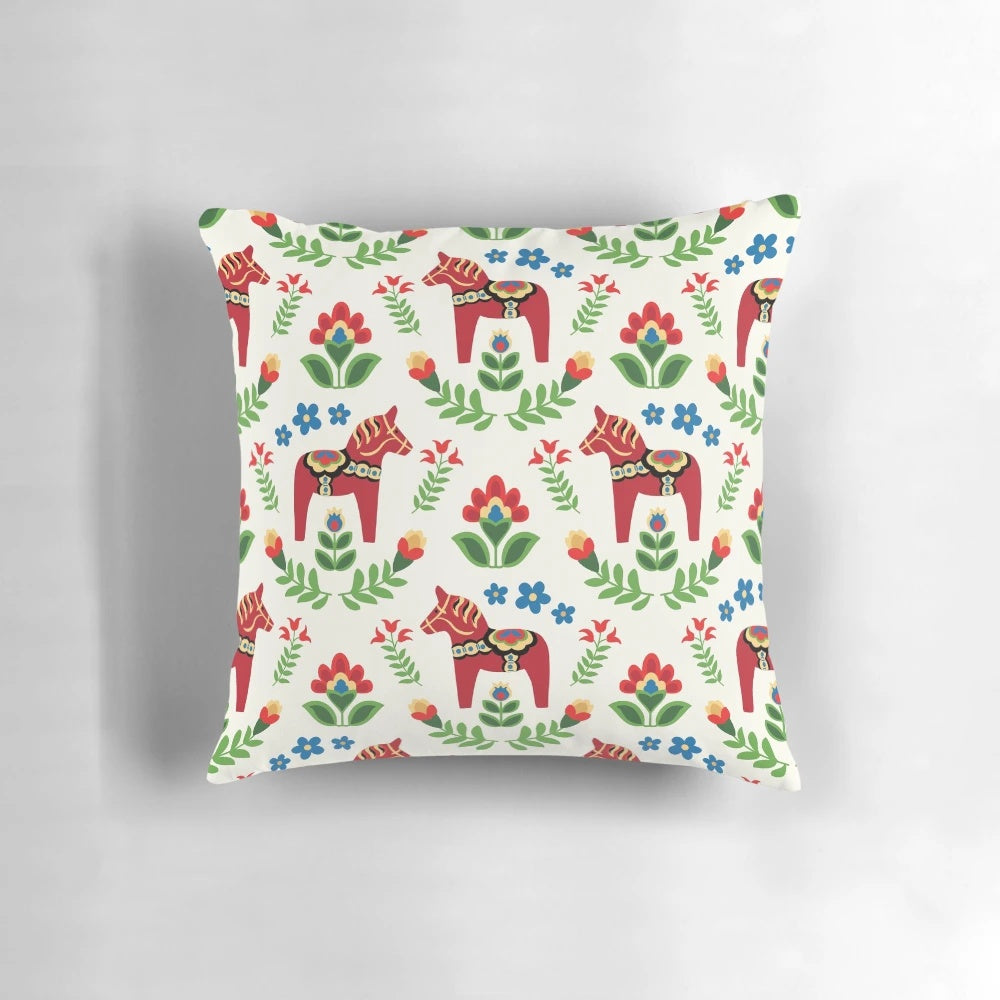 Close-up of a traditional red Swedish Dala horse design on a decorative pillow