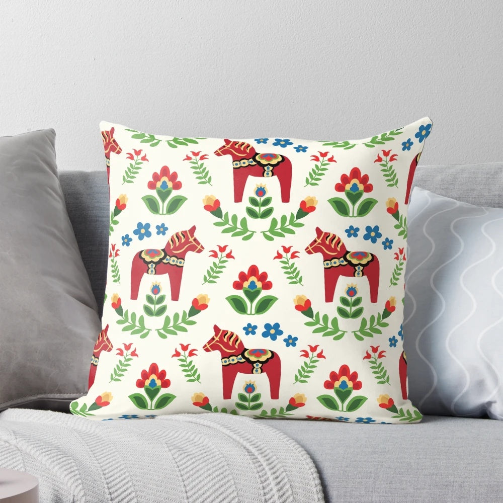 Close-up of a traditional red Swedish Dala horse design on a decorative pillow