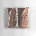 Cozy pillow with a scenic view of a narrow, winding street in the historic city of Venice, Italy