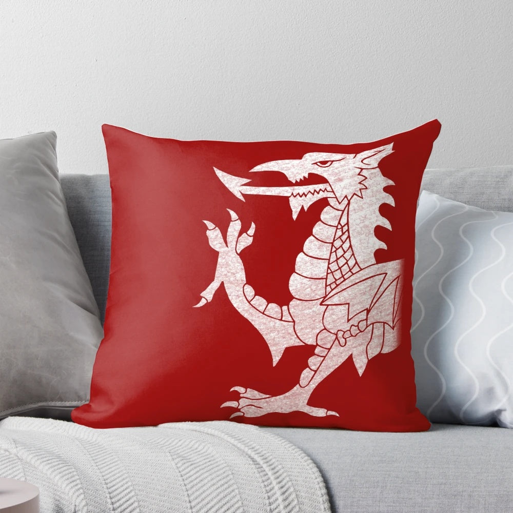 A white pillow with a vibrant Welsh dragon design, perfect for adding a touch of Welsh culture to your home.
