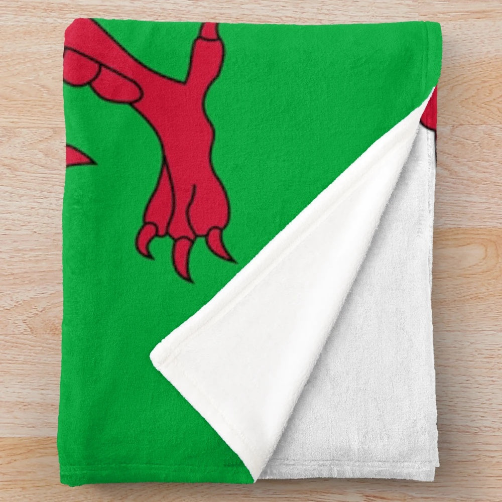 Plush blanket featuring the iconic Welsh national flag design