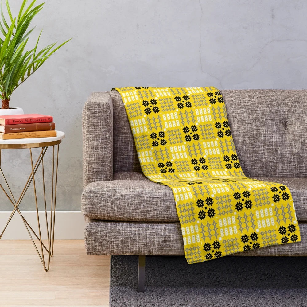 Plush blanket with traditional Welsh Cymraeg design in gold