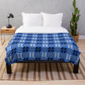 Blue Welsh tapestry pattern plush blanket with traditional Cymraeg design