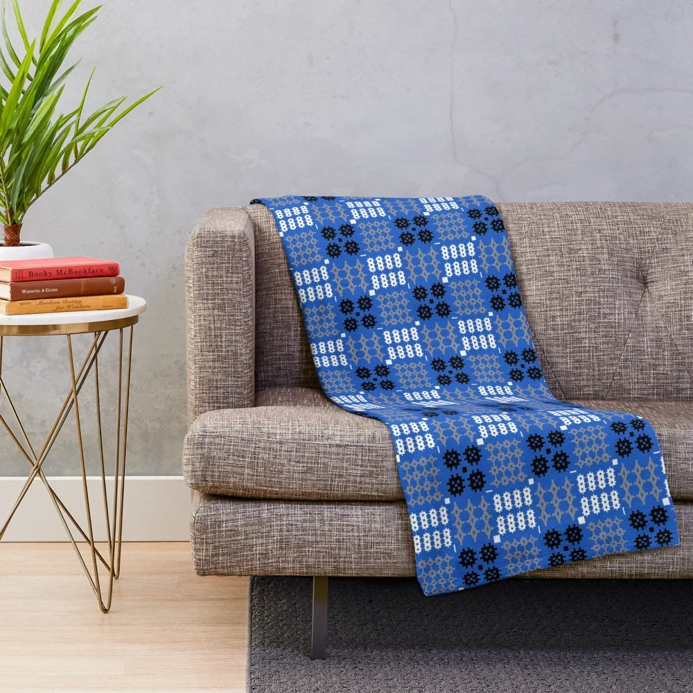 Blue Welsh tapestry pattern plush blanket with traditional Cymraeg design