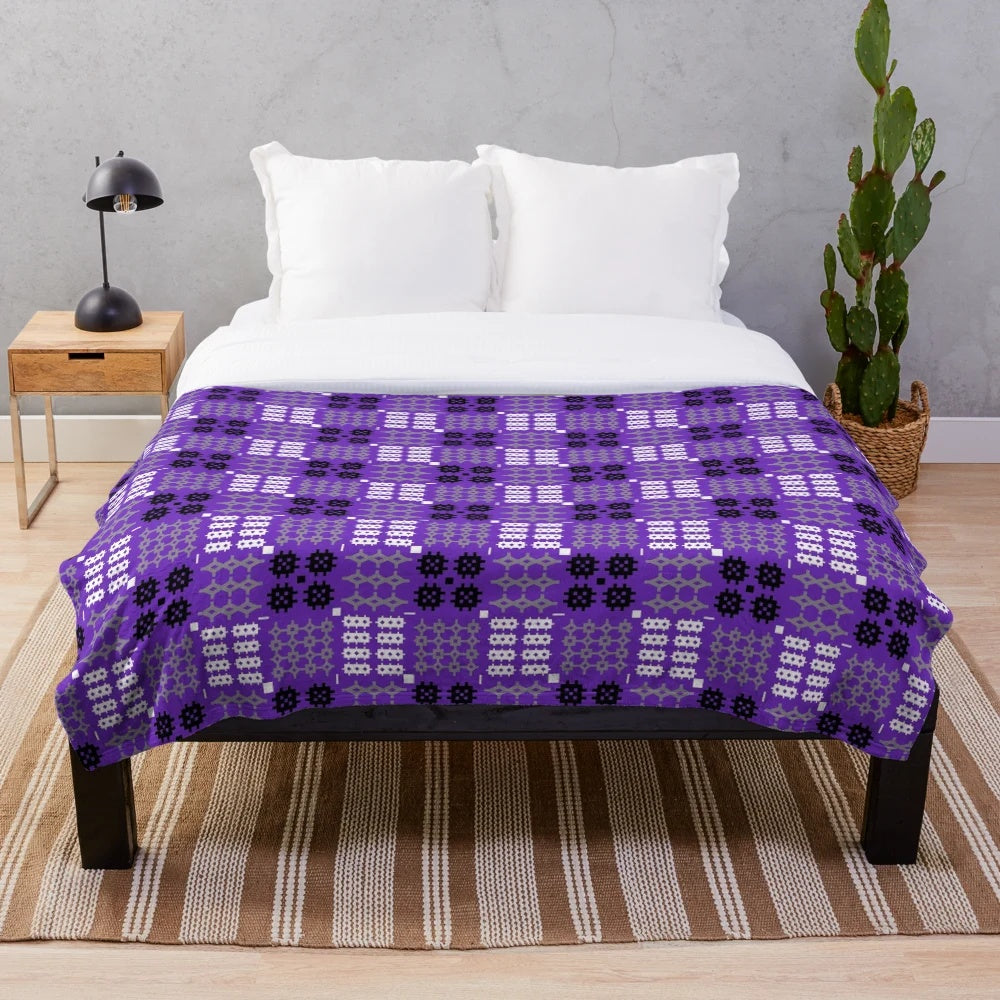 Vibrant Welsh tapestry pattern plush blanket in purple