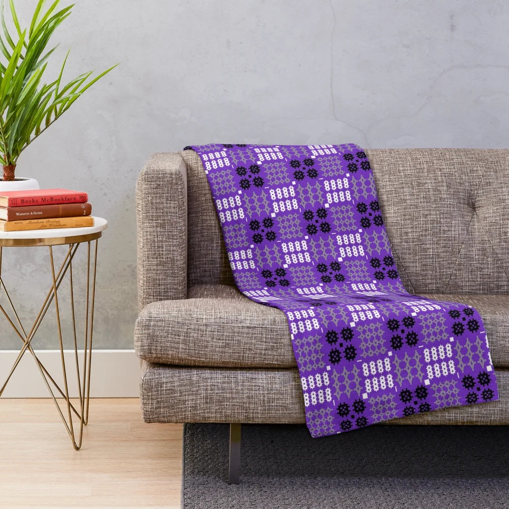 Vibrant Welsh tapestry pattern plush blanket in purple