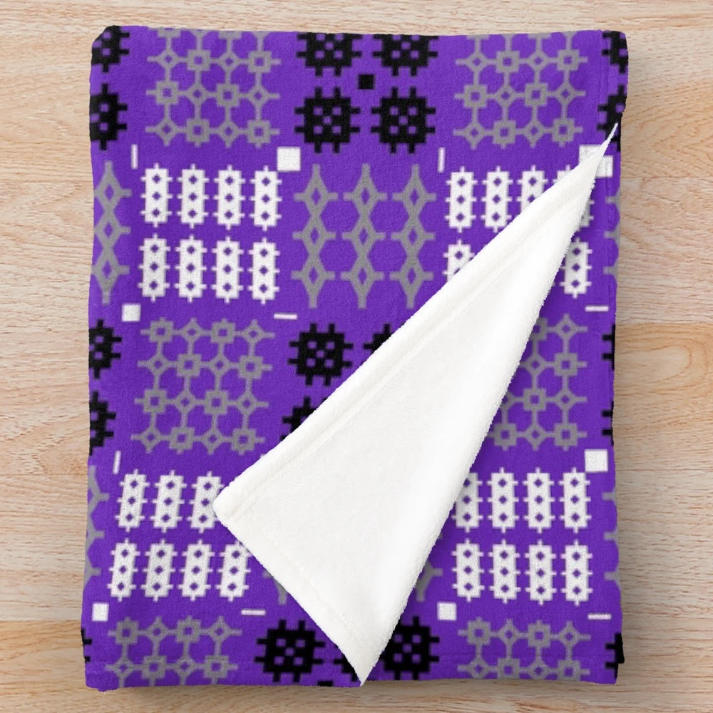 Vibrant Welsh tapestry pattern plush blanket in purple