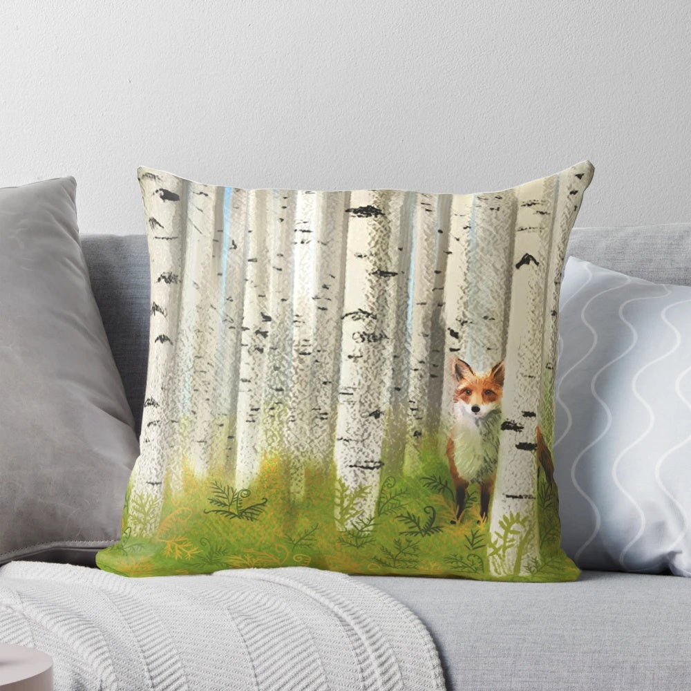 Decorative throw pillow featuring a red fox in an autumn birch forest landscape