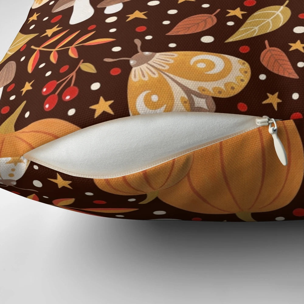 Autumn elements decorative pillow featuring a pattern with leaves, berries, pumpkins, and insects