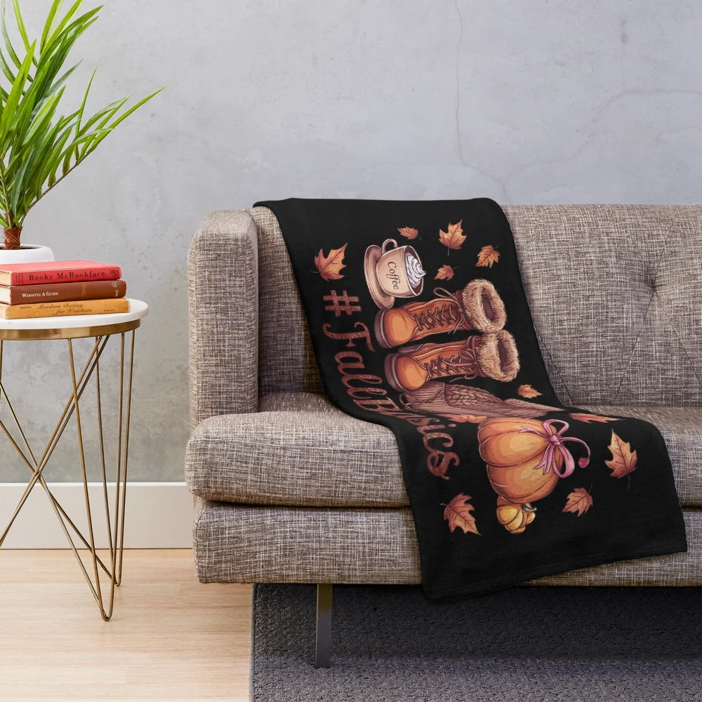 Autumn essentials plush blanket featuring fall elements like leaves, pumpkins, and warm drinks