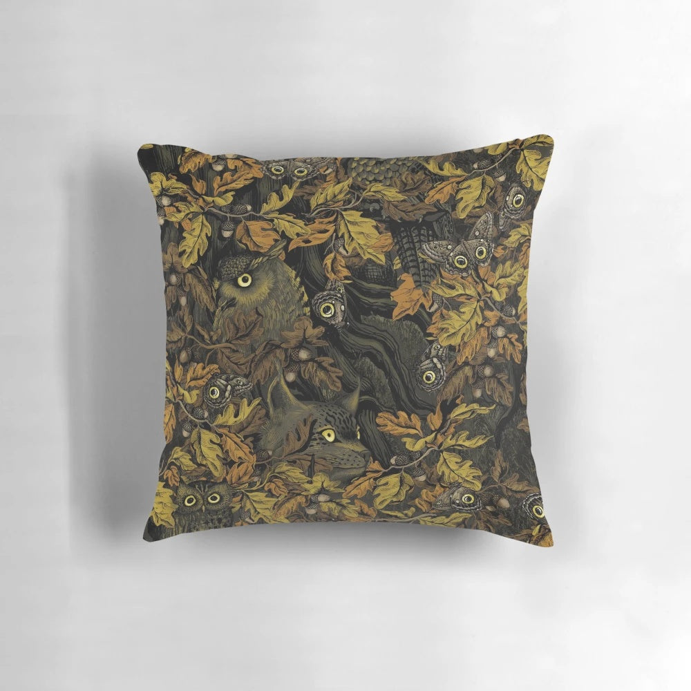 Autumn-inspired camouflage pattern pillow with leaves, acorns, owls, and forest wildlife elements.