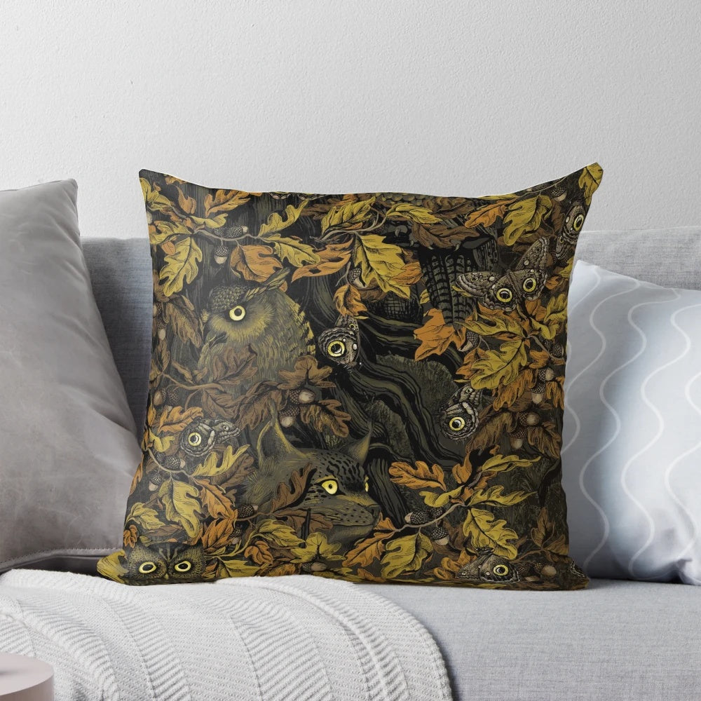 Autumn-inspired camouflage pattern pillow with leaves, acorns, owls, and forest wildlife elements.