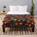 Autumn harvest plush blanket featuring seasonal fruits, pinecones, and fall foliage