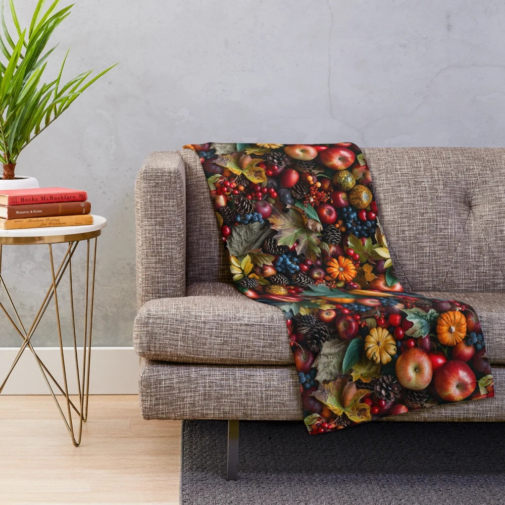 Autumn harvest plush blanket featuring seasonal fruits, pinecones, and fall foliage