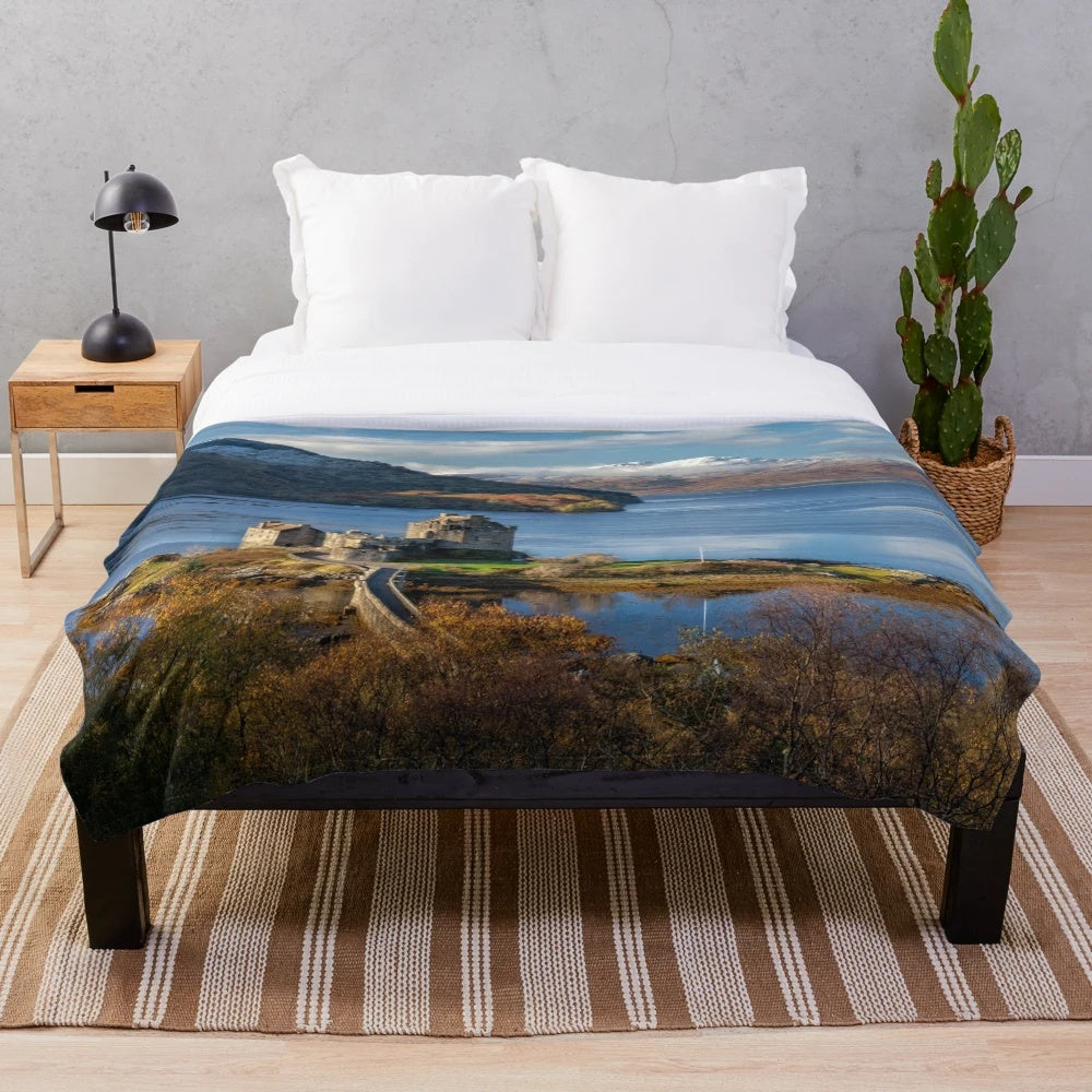 Plush blanket featuring the scenic autumn landscape of Eilean Donan Castle and the Isle of Skye, Scotland