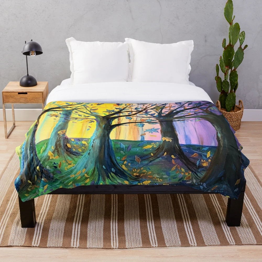 Plush blanket featuring a vibrant autumn-themed forest scene with yellow and purple leaves