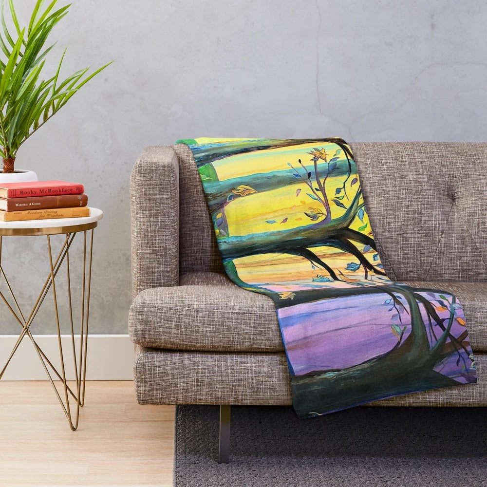 Plush blanket featuring a vibrant autumn-themed forest scene with yellow and purple leaves