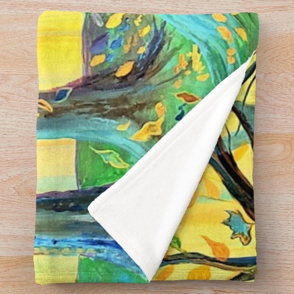 Plush blanket featuring a vibrant autumn-themed forest scene with yellow and purple leaves