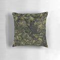 Olive green pillow with autumn leaves, oak acorns, and a camouflage pattern inspired by nature.