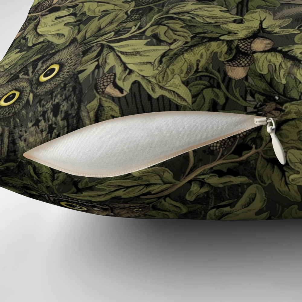 Olive green pillow with autumn leaves, oak acorns, and a camouflage pattern inspired by nature.