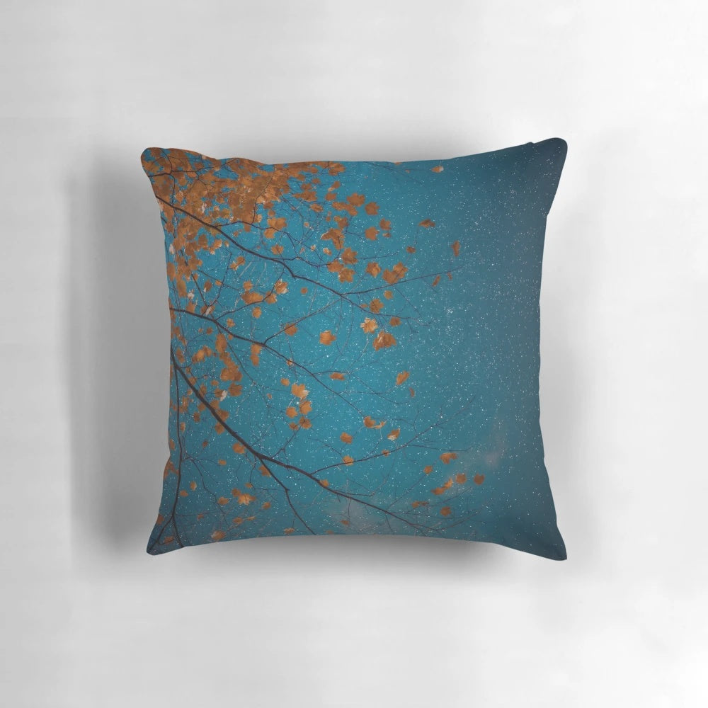 Pillow featuring a beautiful nature photograph of burnt orange maple leaves against a midnight blue sky with stars.