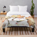Plush blanket with vibrant autumn leaves design