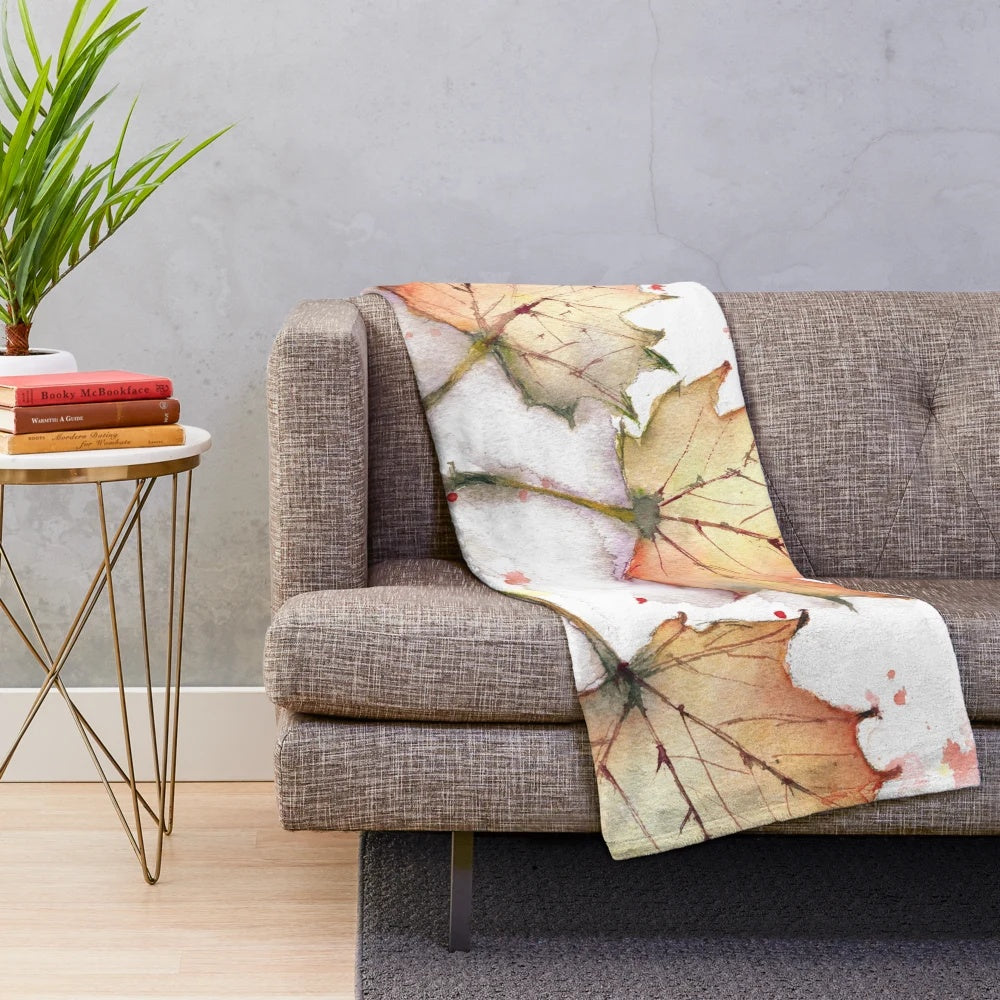 Plush blanket with vibrant autumn leaves design