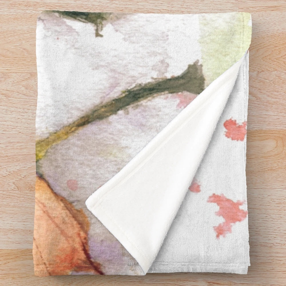 Plush blanket with vibrant autumn leaves design
