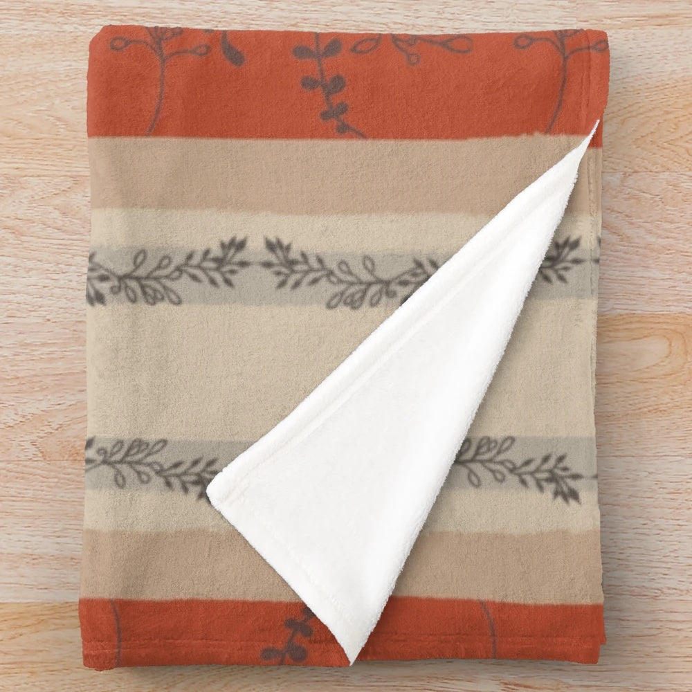Autumn leaves plush blanket with rust, brown, and tan colors