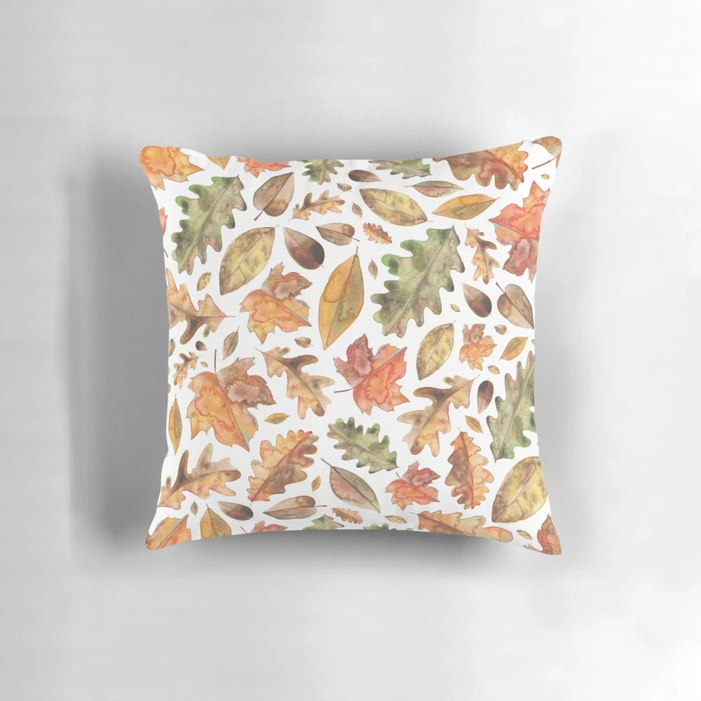 Autumn leaves watercolor design printed on a soft, plush pillow