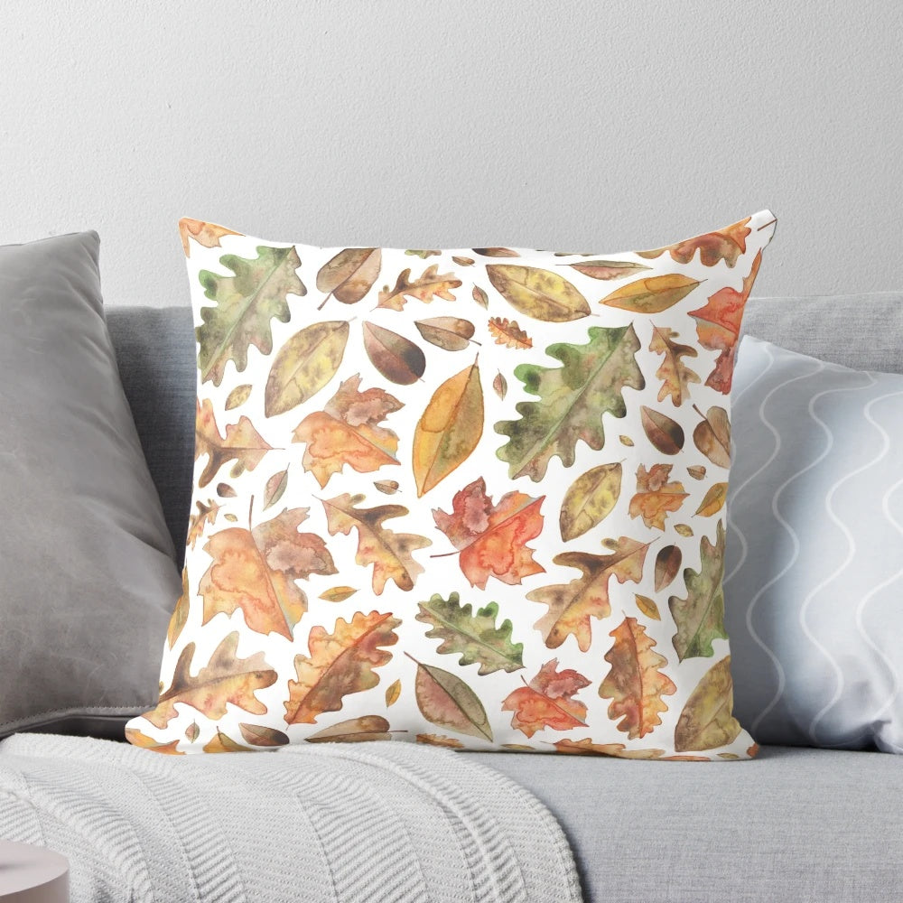 Autumn leaves watercolor design printed on a soft, plush pillow
