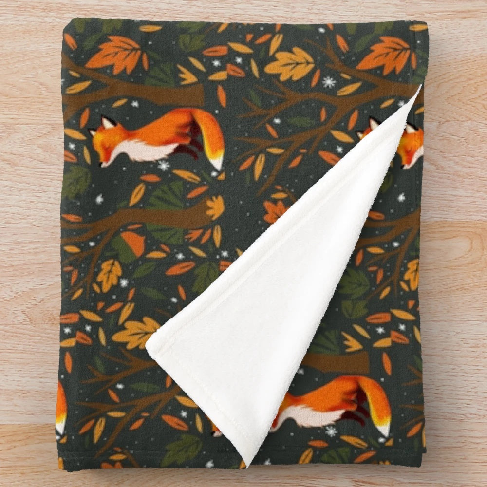 Soft, plush blanket featuring an autumn-inspired fox design