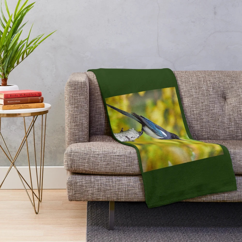 Plush blanket with vibrant autumn colors and a Eurasian magpie design