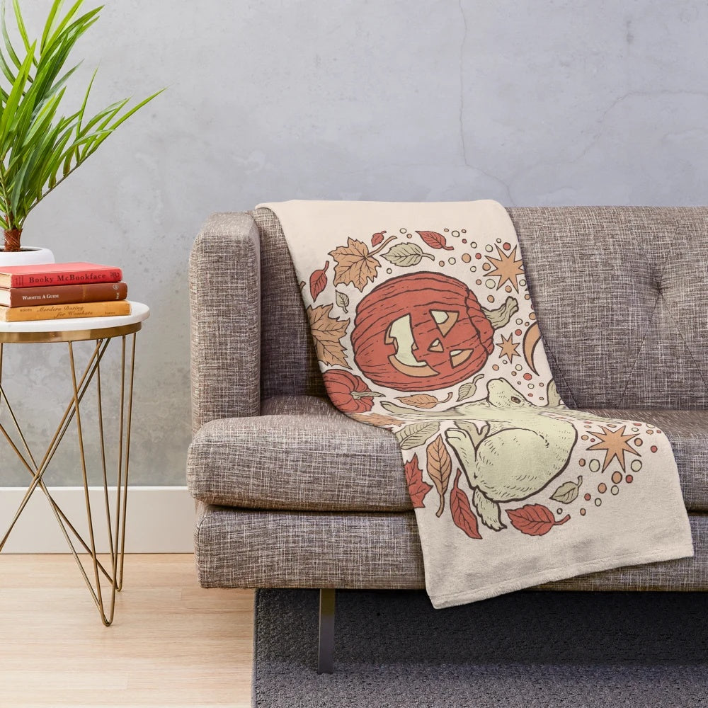Autumn plush blanket featuring a jackalope and jack-o-lantern design
