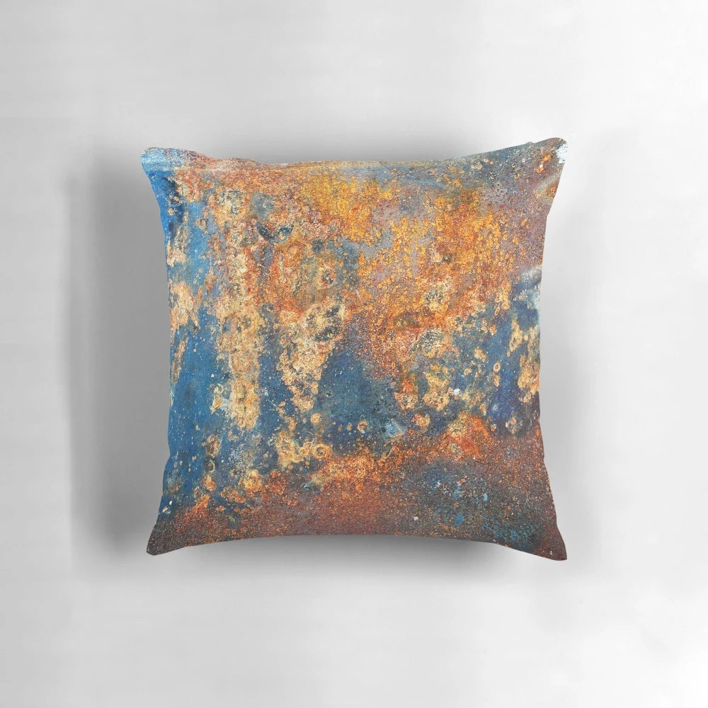 Autumnal rust-colored abstract art pillow with textured, industrial-inspired design
