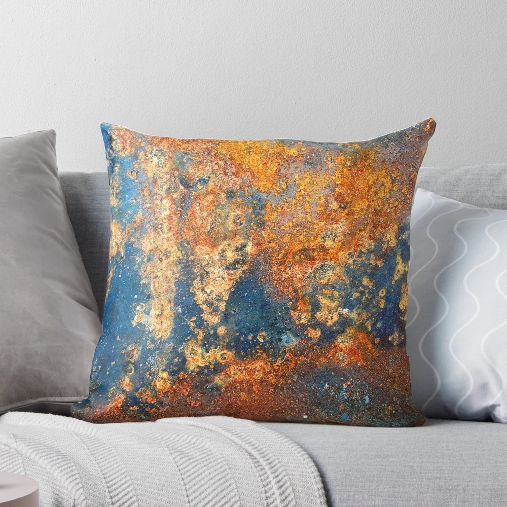 Autumnal rust-colored abstract art pillow with textured, industrial-inspired design