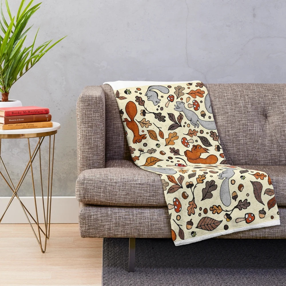 Soft and cozy plush blanket with a squirrel pattern, perfect for autumn and fall decor.