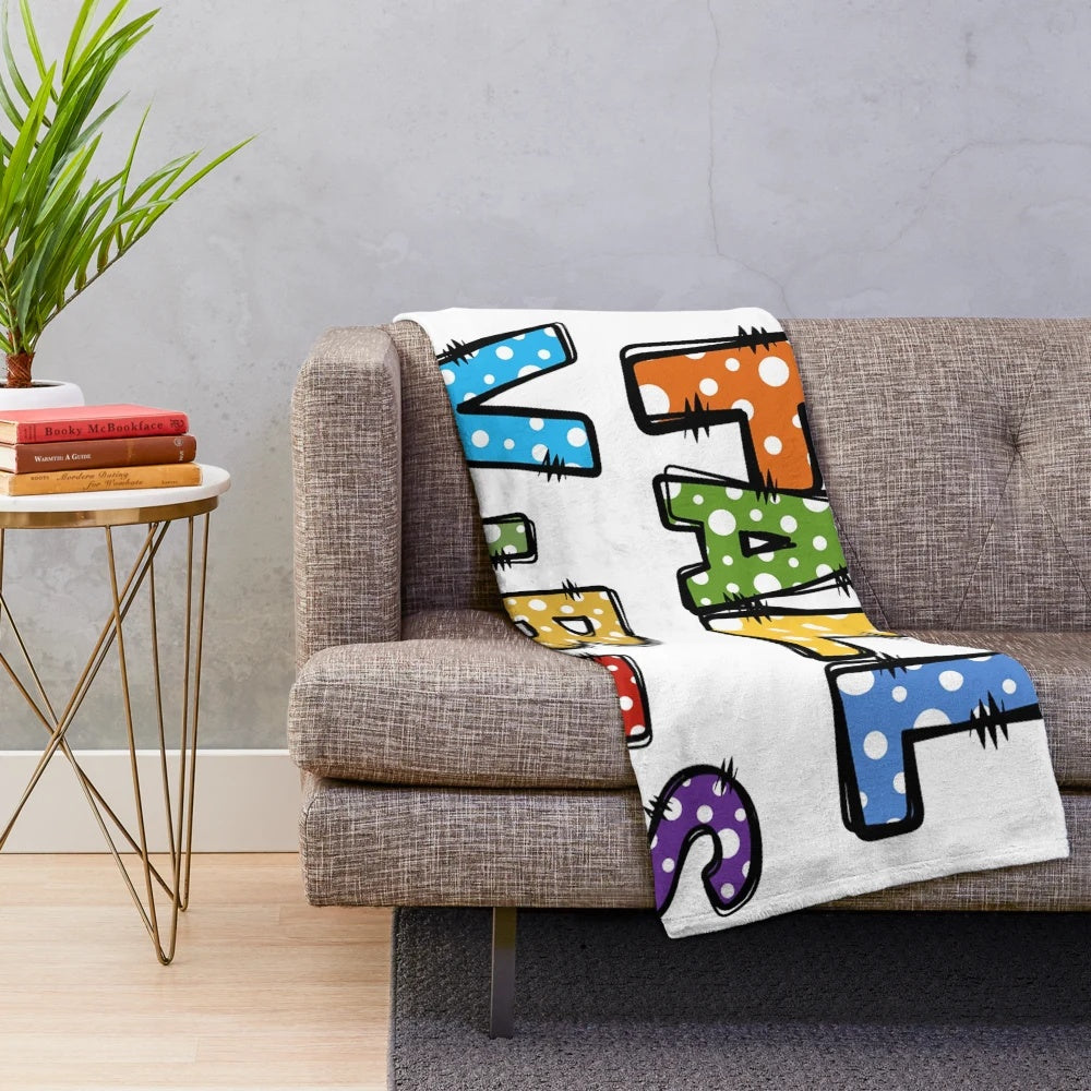 Soft and cozy plush throw blanket with fall leaves and pumpkin pattern
