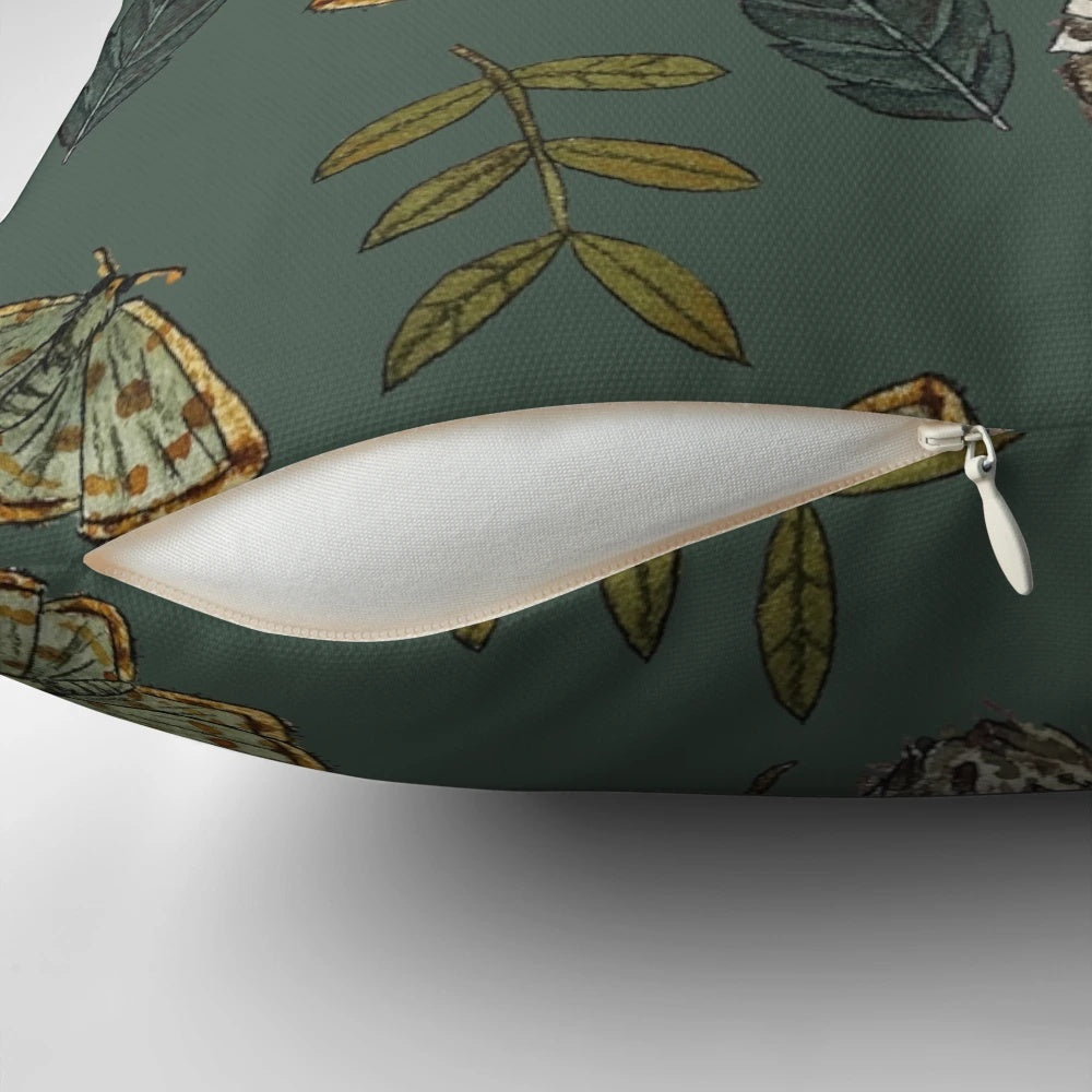 Decorative pillow featuring a botanical illustration of the Amanita muscaria mushroom surrounded by autumn leaves.