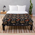 A colorful plush blanket featuring a whimsical design of hedgehogs and mushrooms in an autumn-inspired botanical pattern.