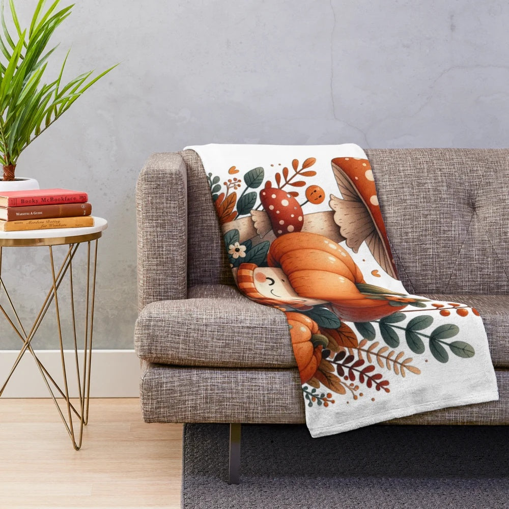 Whimsical illustration of autumn mushrooms and pumpkins on a cozy plush blanket