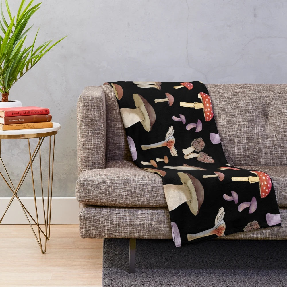 Plush blanket featuring a hand-painted design of autumnal mushrooms and pastel-colored foliage