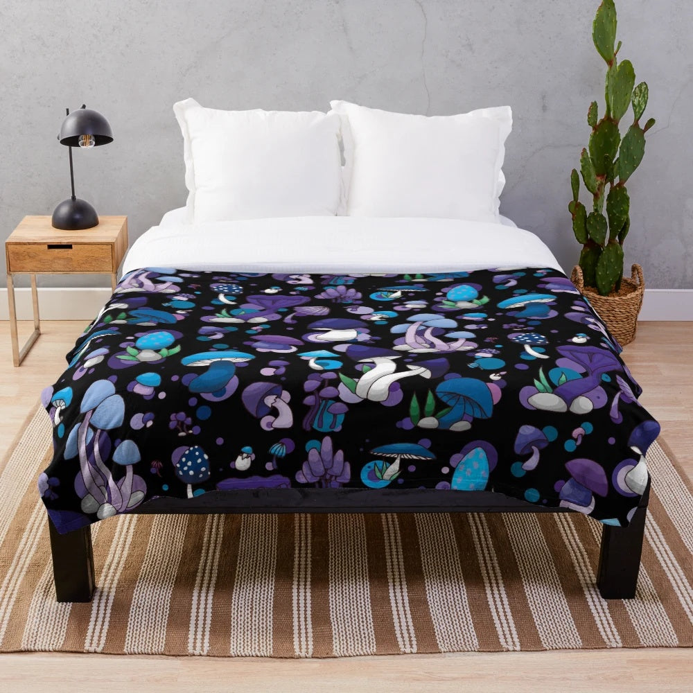 Cozy and plush mushroom-themed blanket in blue, lilac, and violet tones